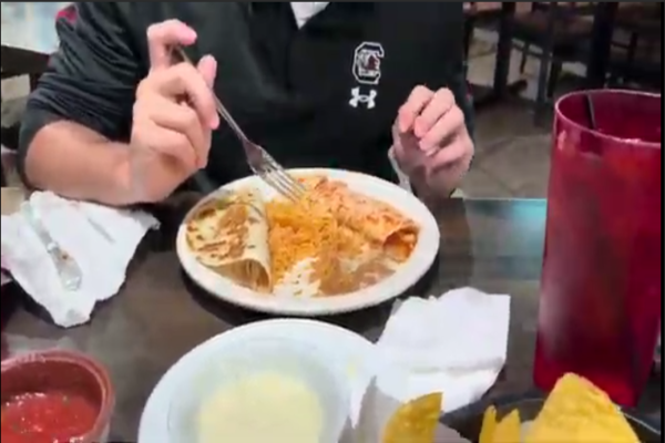 SENIOR NATE WALLACE indulges in Mexican cuisine at Sidestreet Cantina at the Oceanfront. at the . Wallace was joined by seniors Jacob Palmerton and Rex Miller. 