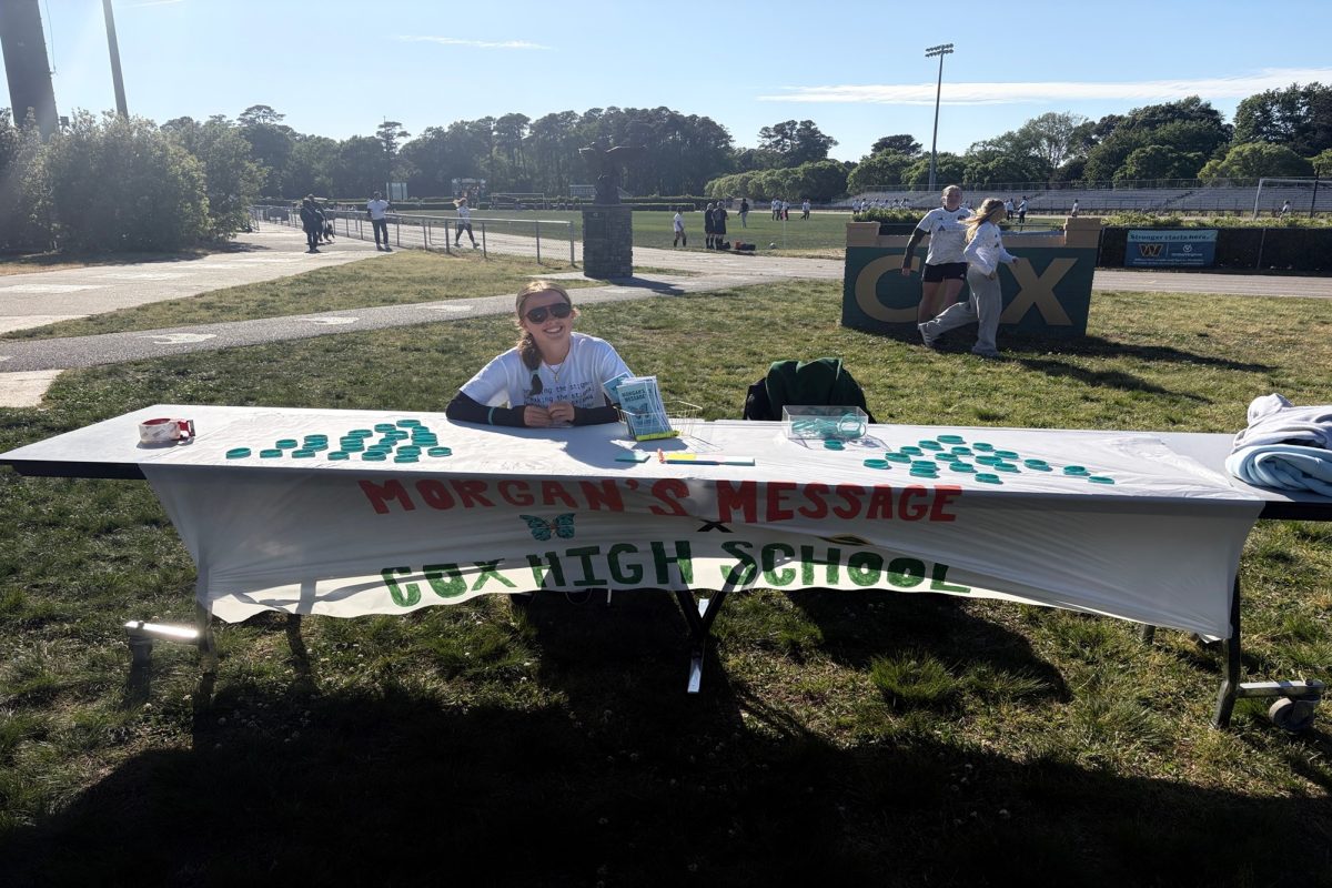 FRESHMAN CLAIRE CHAMBERLAIN manned the Morgan's Message table before the girls and boys soccer games in early May.  Bracelets, stickers, and sticky notes that promoted positive messages were available in effort to spread the word.