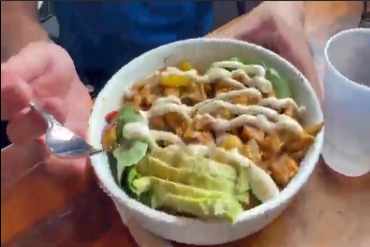 SENIOR VANCE DELASHMUTT shows off his power bowl at American Brew. Seniors Jacob Palmerton and Nate Wallace had added Delashmutt as a special guest, as part of the final food review.